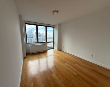 11th St & West 57th Street - Photo Thumbnail 2