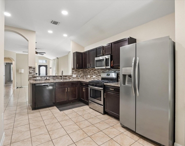 10110 Lampton Ln - Photo Thumbnail 3
