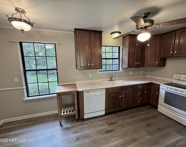 1692 E Holly Oaks Lake Road E - Photo Thumbnail 2