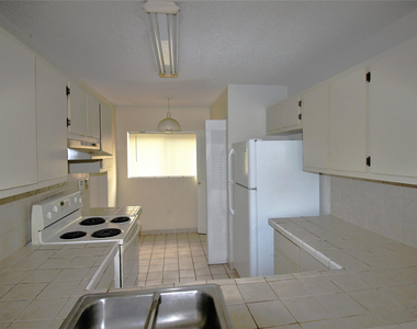 9477 Palm Circle N - Photo Thumbnail 2