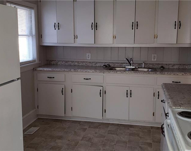 1011 E 10th Street - Photo Thumbnail 2