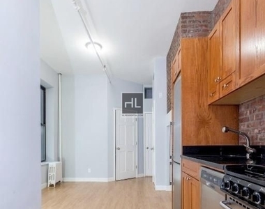 W 51st St. - Photo Thumbnail 1