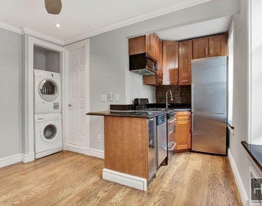 W 51st St. - Photo Thumbnail 3