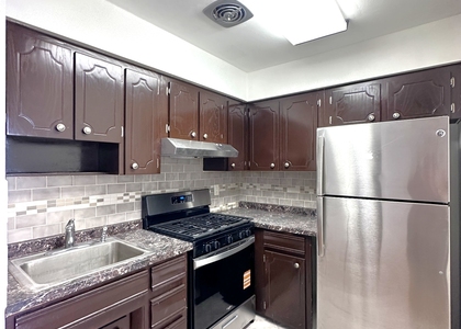 65-12 Maurice Ave - Photo 1