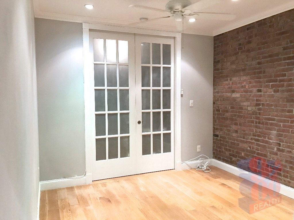 209 E 25th  - Photo 6