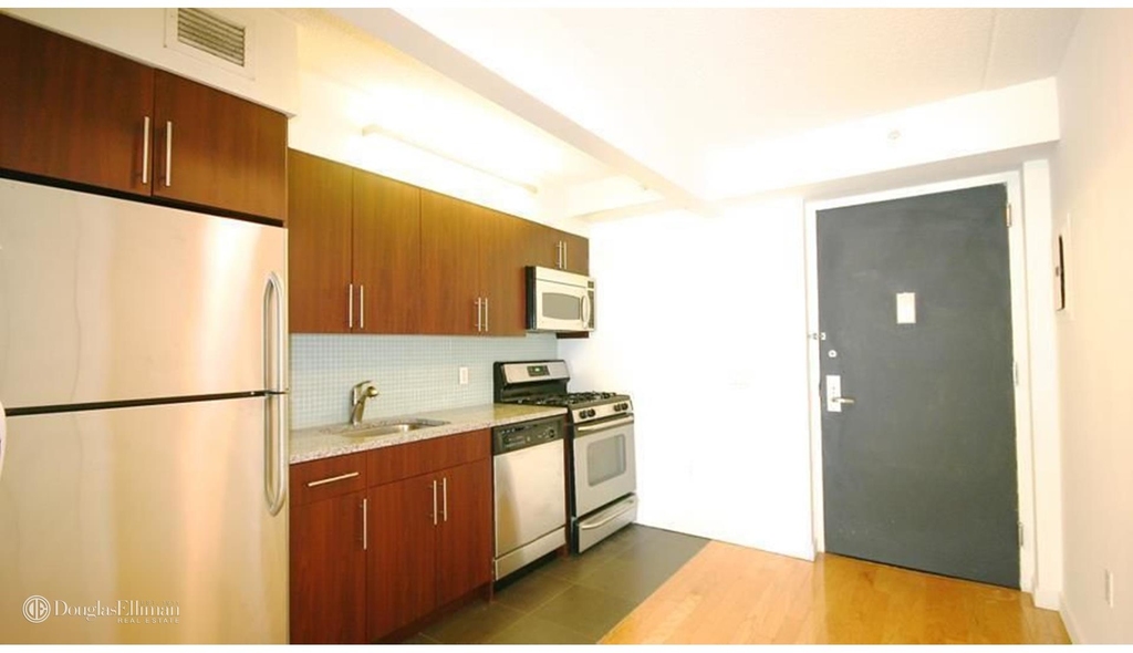 555 West 23rd St - Photo 2