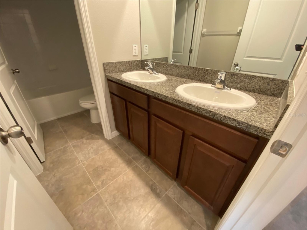 7407 Rosy Periwinkle Court - Photo 18