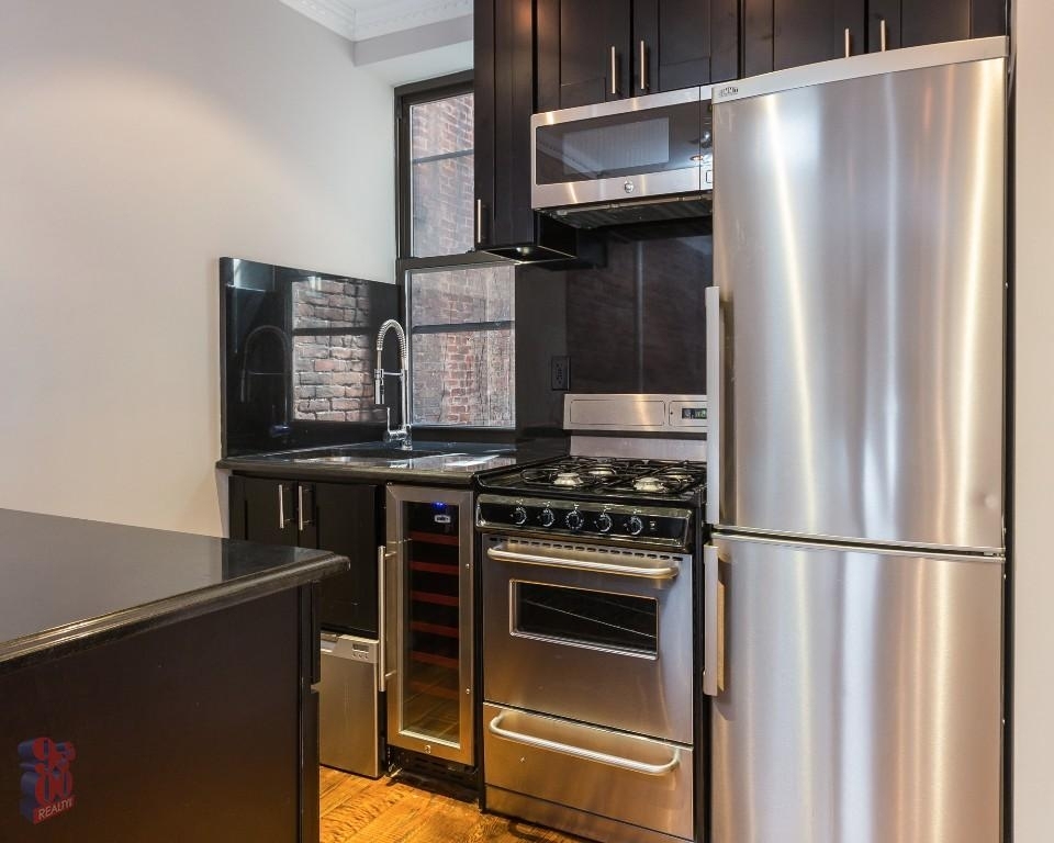 Copy of 438 West 52nd Street, Unit 1a - Photo 0