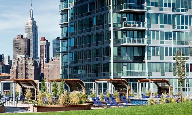 4545 Center BoulevardStunning 1 bed apartment featuring a home office area and private balcony with partial views of the East River. This home also features a spacious living area, open kitchen, ample closet space, and southern exposure. - Photo 8