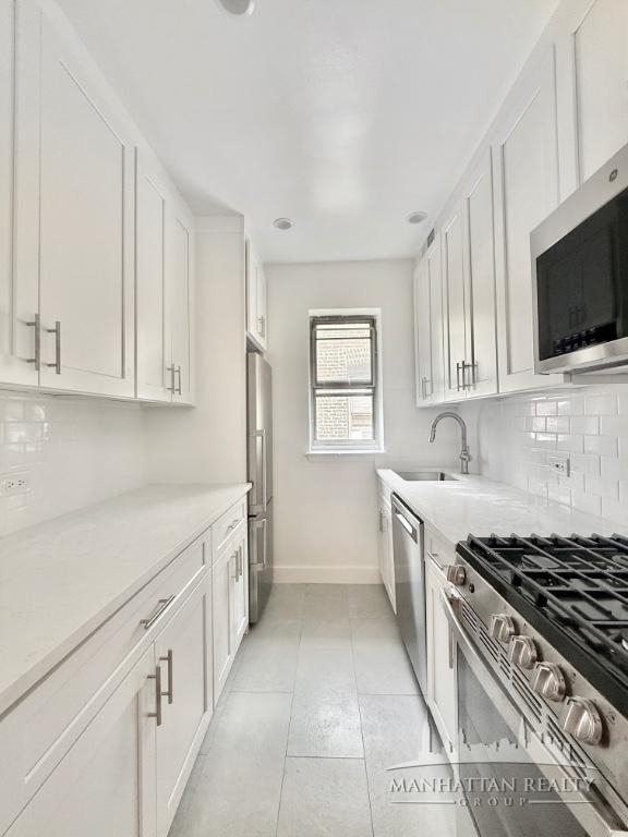 E 12th St - Photo 3