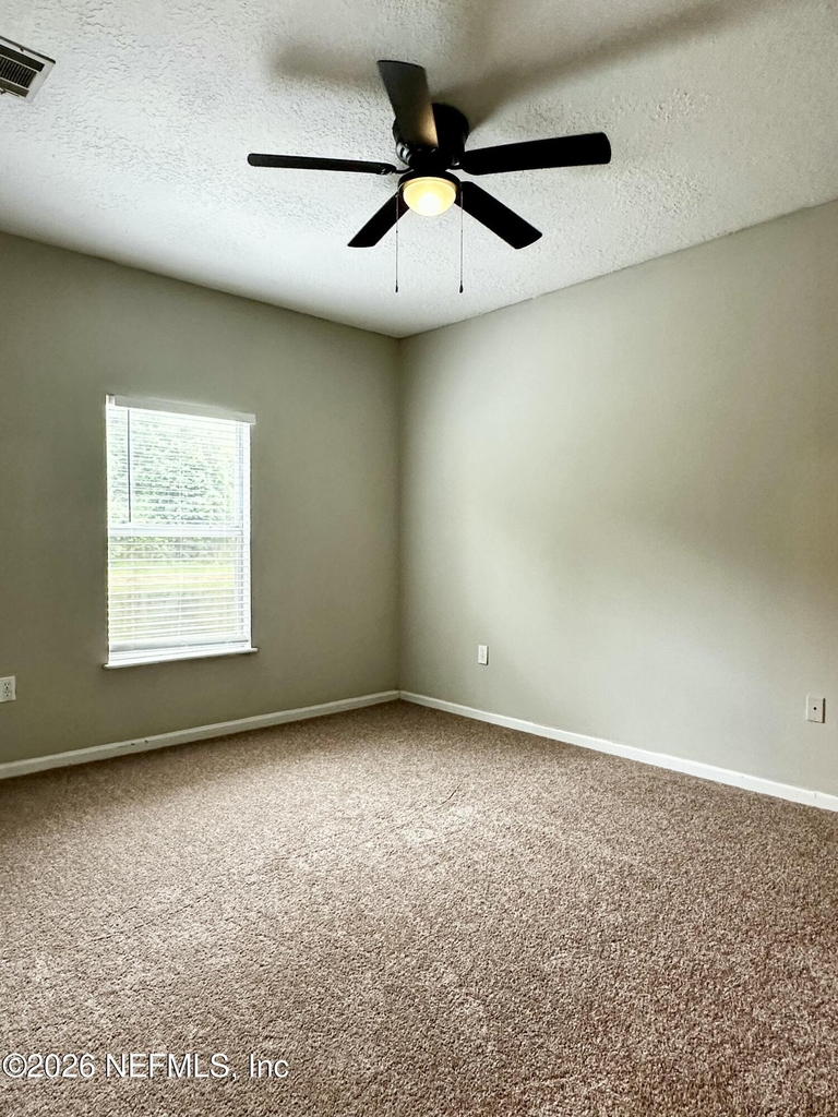 6985 Ortega Woods Drive - Photo 5