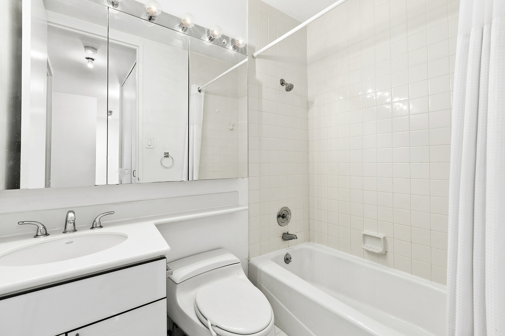 235 E 40th St - Photo 6