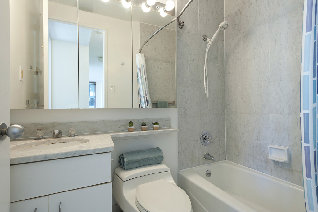 235 E 40th St - Photo 7