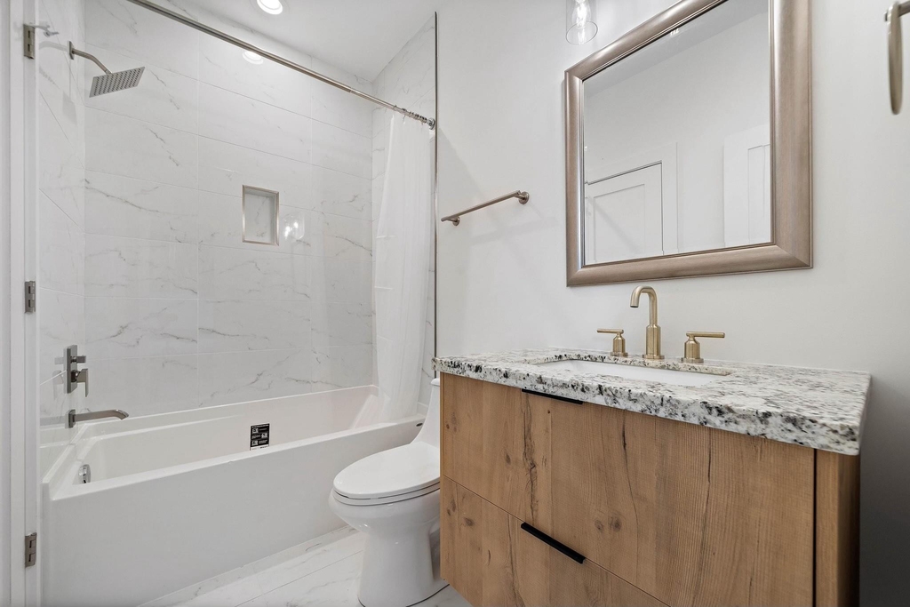 207 E 38th Street E - Photo 6