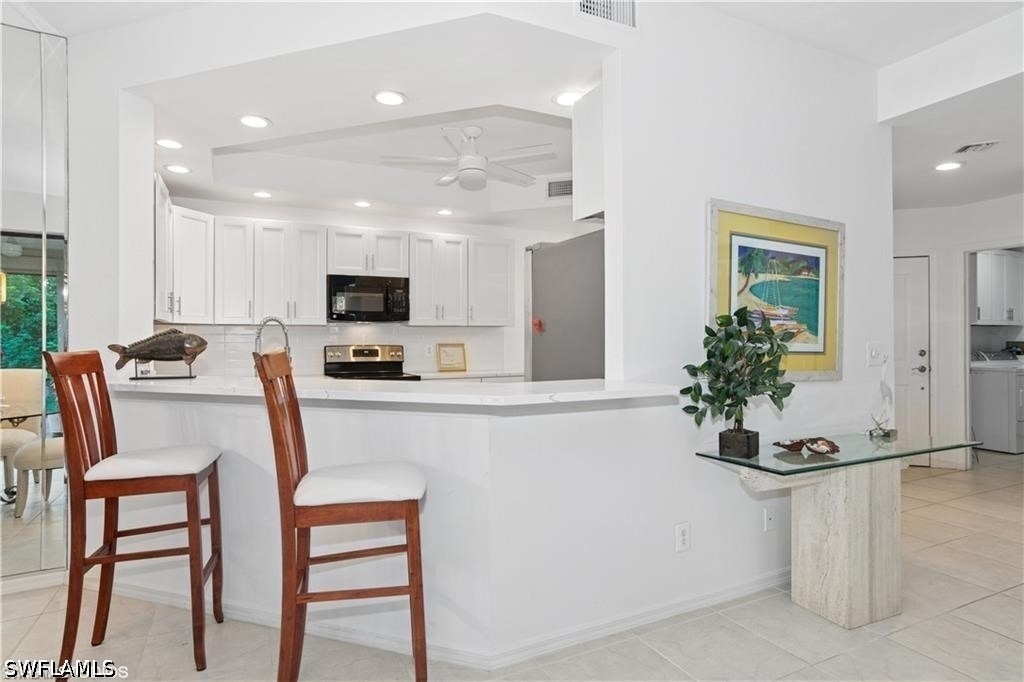 7048 Pelican Bay Boulevard - Photo 5