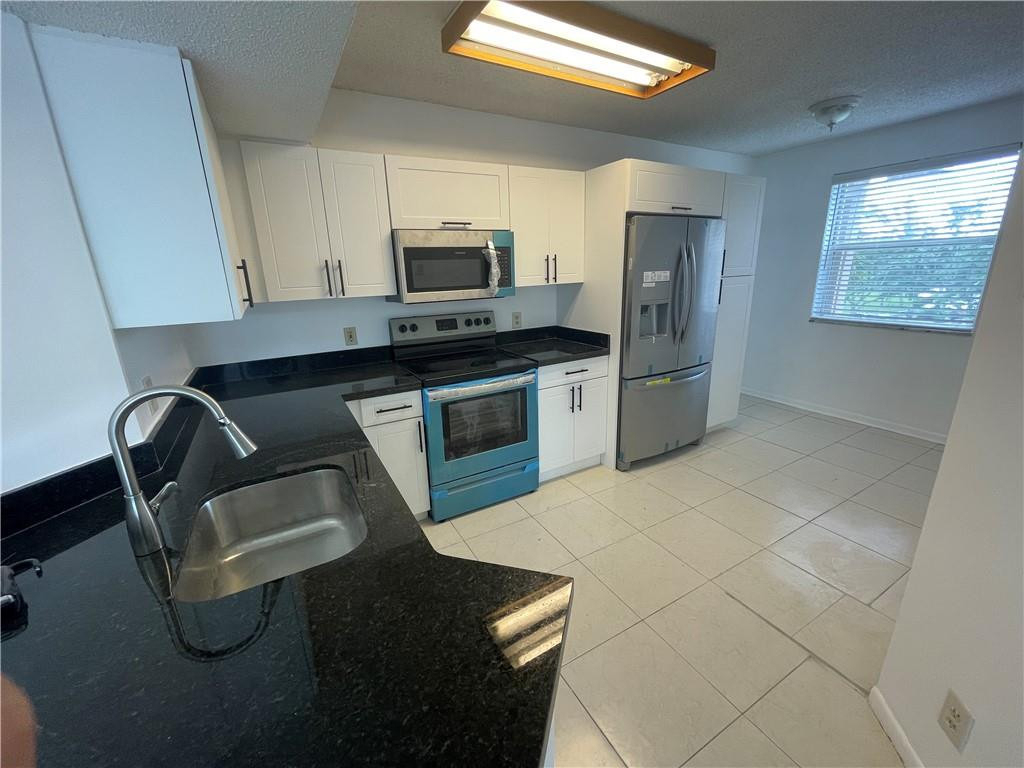 9033 Wiles Road - Photo 2