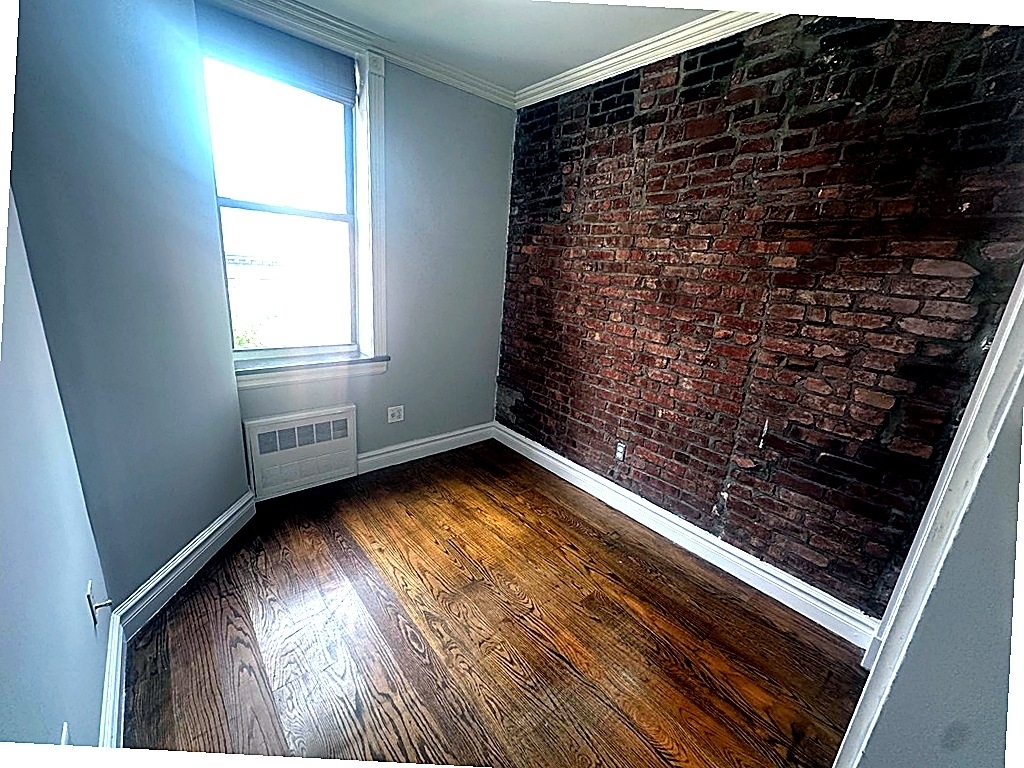 West 14th Street — 2 Bed - Photo 3
