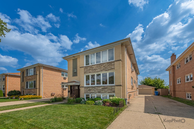 8465 W Berwyn Avenue - Photo 1